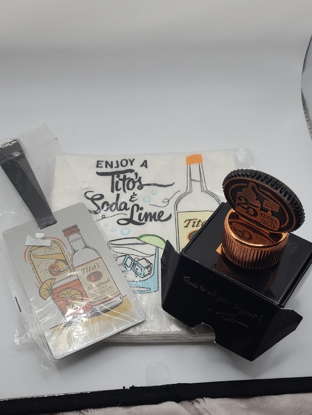 Tito's Vodka 25th Anniv Collector’s Bottle Topper Stopper NIB, Luggage Tag,towel